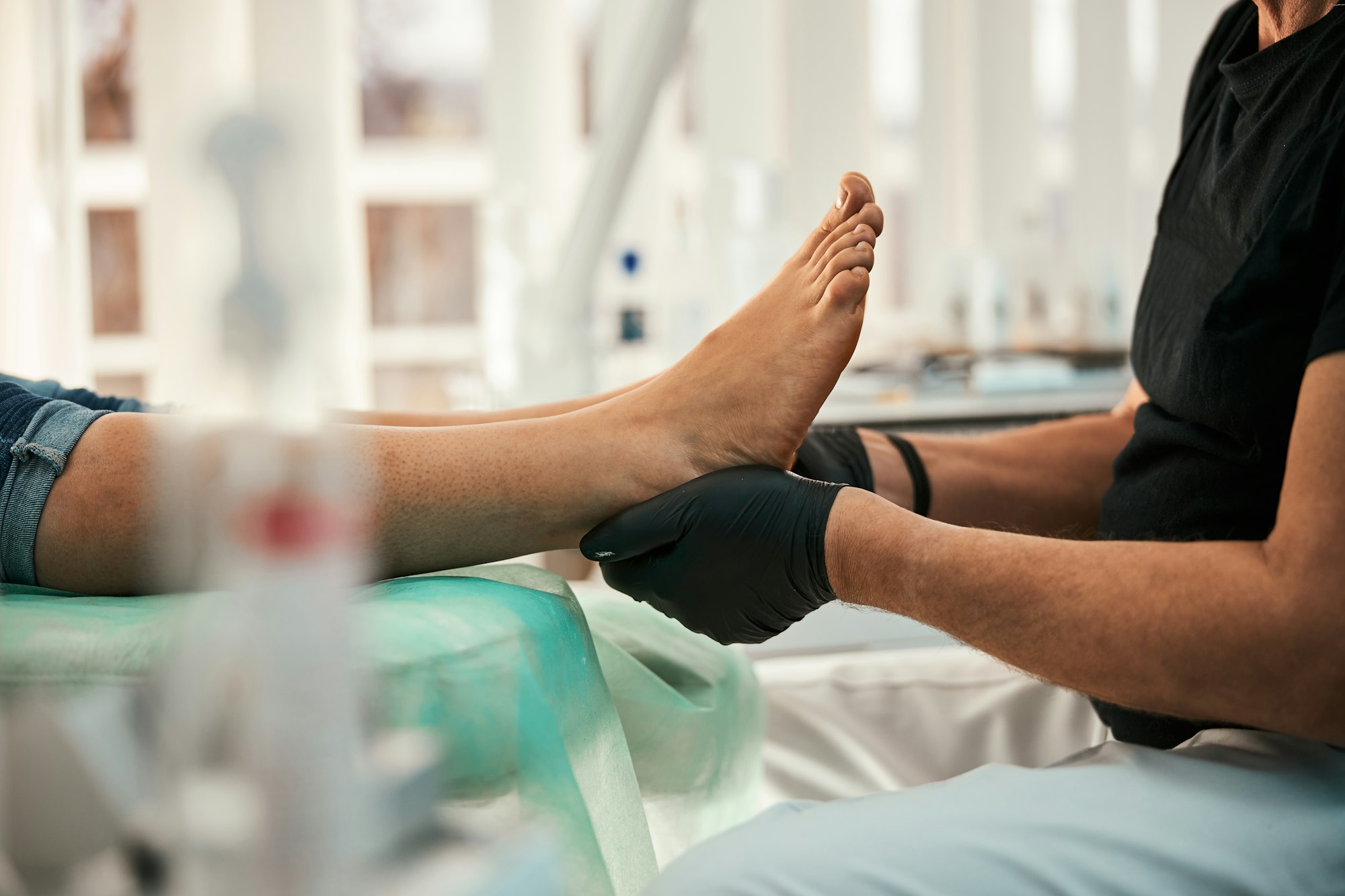 Close up of competent doctor doing foot massage