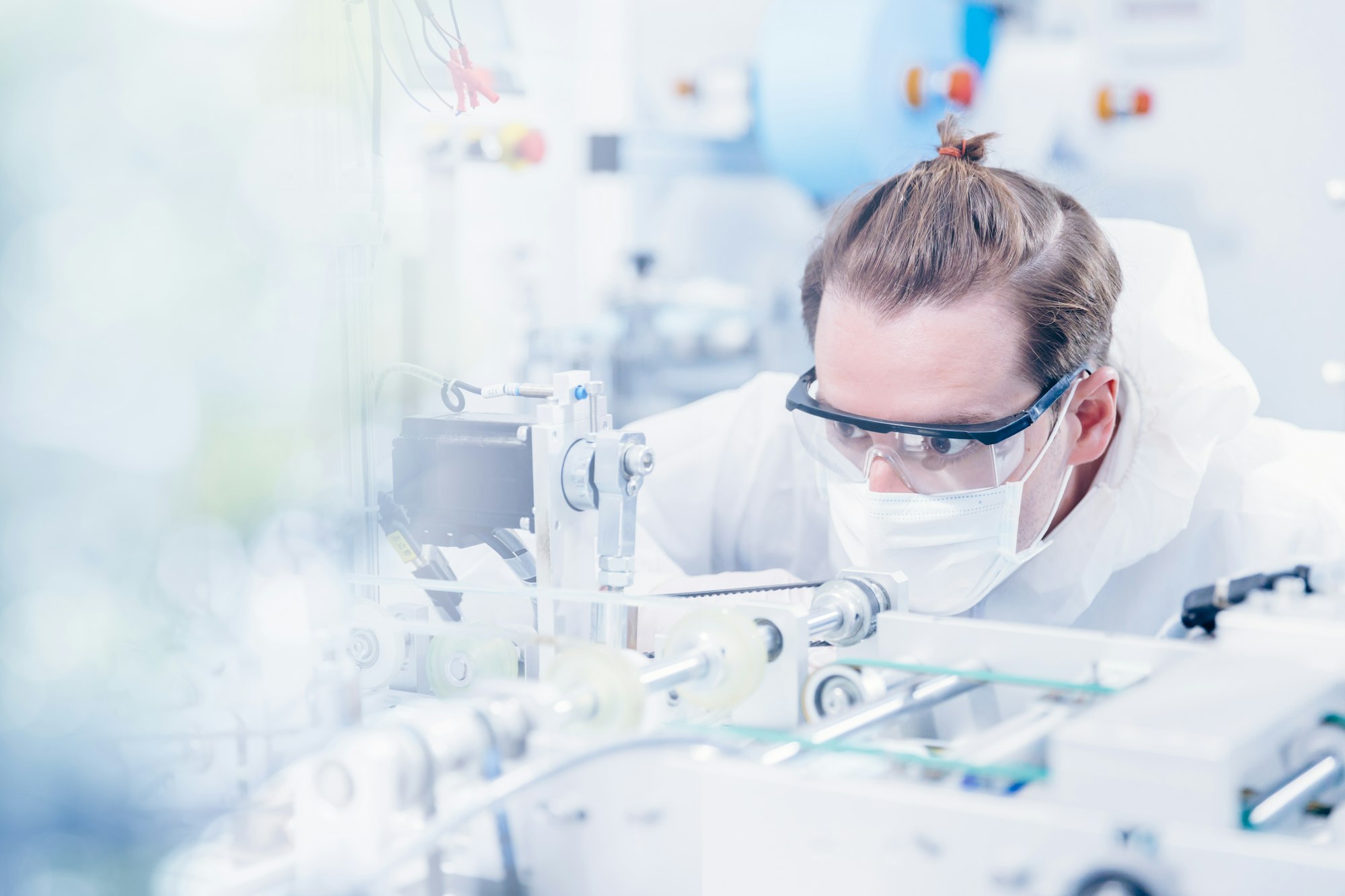 Engineering scientist working with advanced technology medical device in science laboratory